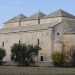 Sconfiniamo definitivamente dal centro storico per l'ultima tappa del nostro viaggio:  impossibile lasciare Valenzano senza aver visto la chiesa di Ognissanti di Cuti, gioiello del XI secolo immerso tra gli ulivi delle campagne circostanti